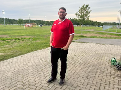 Tim Marsh poses outside of Strathclair Sports Complex (Andrew Stuetz/Untapped North)
