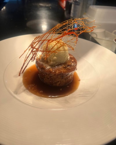 Sticky Toffee Pudding served with ice cream - Queen's Café