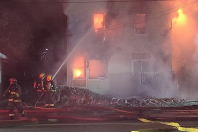 Firefighters douse 32 Lakeshore Dr. with water on a freezing March morning.