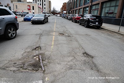 Looking South from Elm Street. You can see the outline of the railbed in the asphalt extending down Lisgar St.
