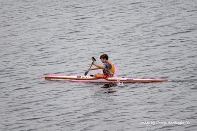 A morning paddler going through his paces.