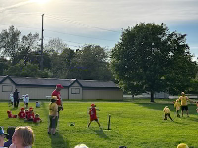 Jade takes her turn at bat under the guidance of Coach Rob! 