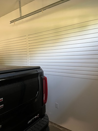 Trusscore vertical panels above and below Trusscore slatwall