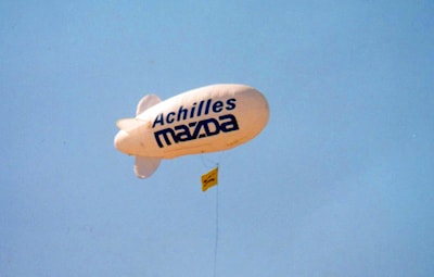 Large balloon hovering above Achilles Mazda Dealership - April 1998 Photo Credit: The New Tanner Archives Collection