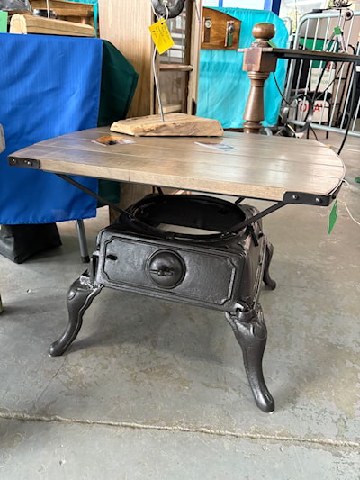 Denis J. Belanger's repurposed stove base table. He does the steel work and the woodwork on every created piece. 