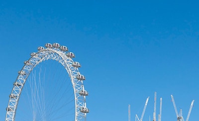 I like the structure of the "EYE" next to the tower cranes along the river