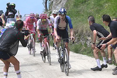 Derek Gee (in the blue jersey) leading Carapaz and Del Toro on a climb