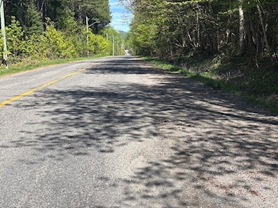 A downhill stretch on 4th Line on a sunny day