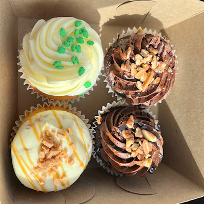 Simply Vanilla, Turtles and Toffee Crunch cupcakes from a bakery in Southern Ontario.