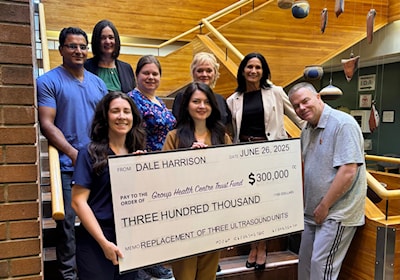 Dale Harrison with Group Health Centre CEO, Lil Silvano and ultrasound technicians.